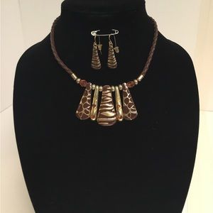 Two tone giraffe and tiger print necklace with matching pierced earrings.